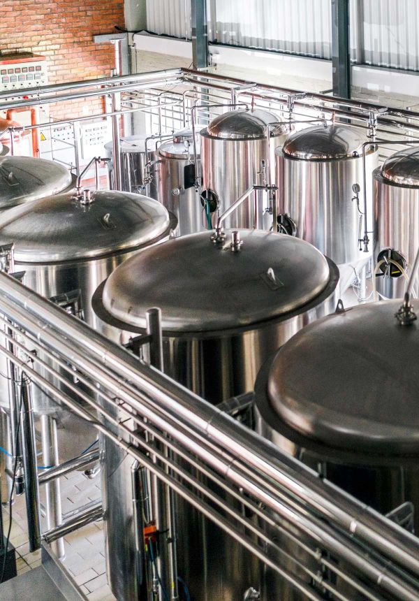 brewery engineering - rows of stainless steel brewery tanks