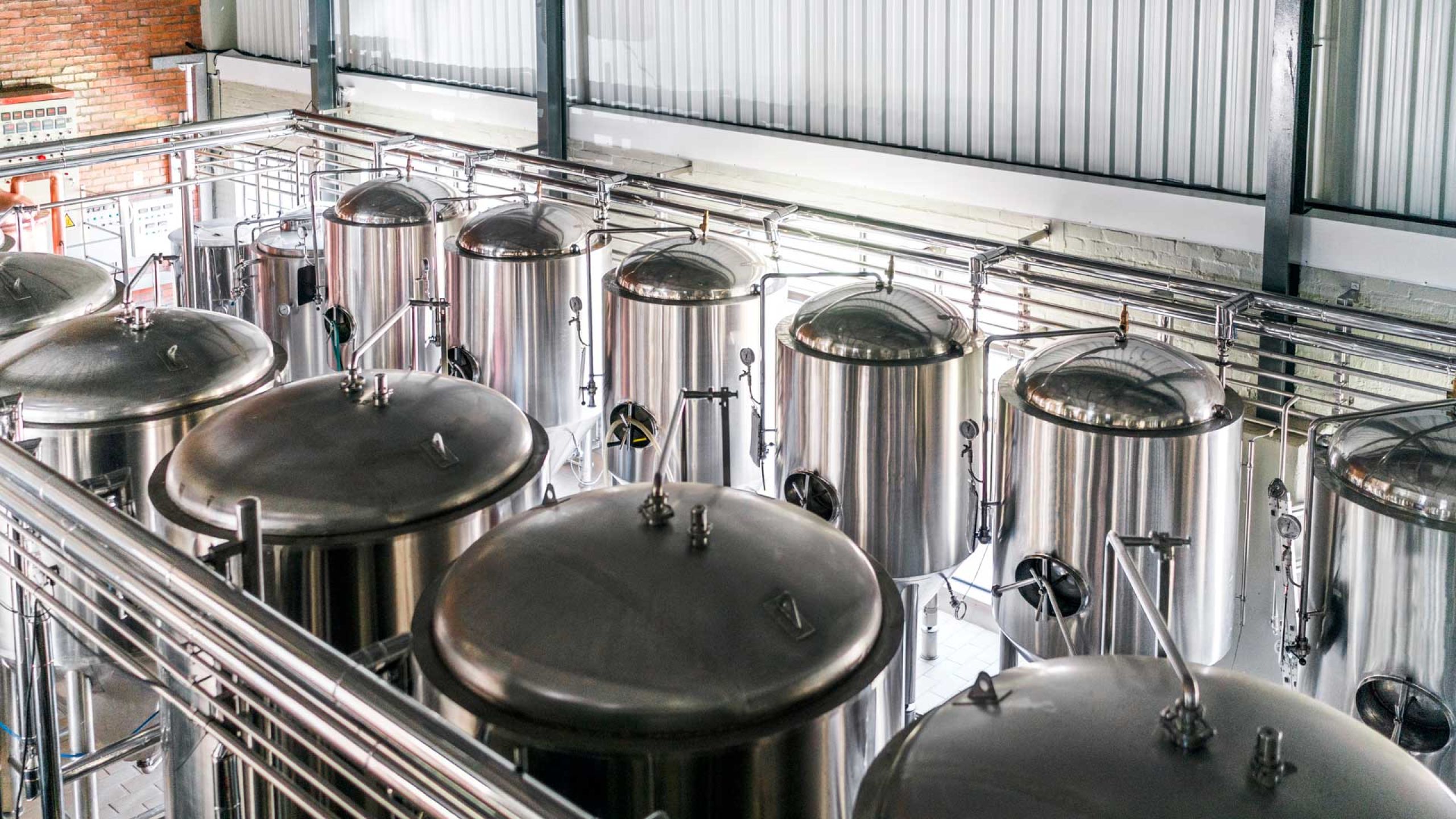 brewery engineering - rows of stainless steel brewery tanks